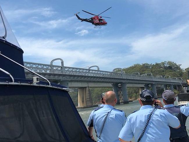 Search... Police at Como Bridge during the search for Connor. Picture:Twitter/ Westpac Life Saver Rescue Helicopters
