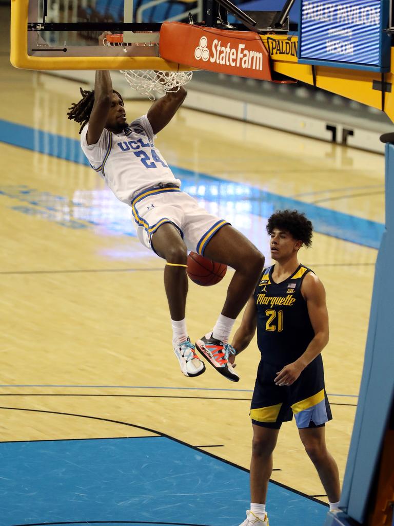 Jalen Hill with the huge dunk. Photo by Katelyn Mulcahy/Getty Images