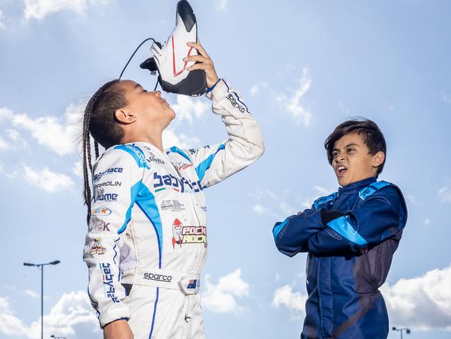 Koda, 9, with his brother Oscar, 11, dreams of the day he can do a real shoey on the world stage. Picture: Jake Nowakowski