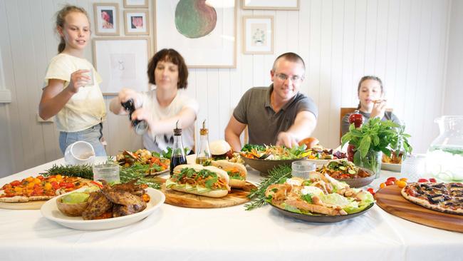 GOOD FOOD: Local food scientists Karen and Jeff Schultheiss with their two daughters. Picture: Kat Lynn (Foodie shots).