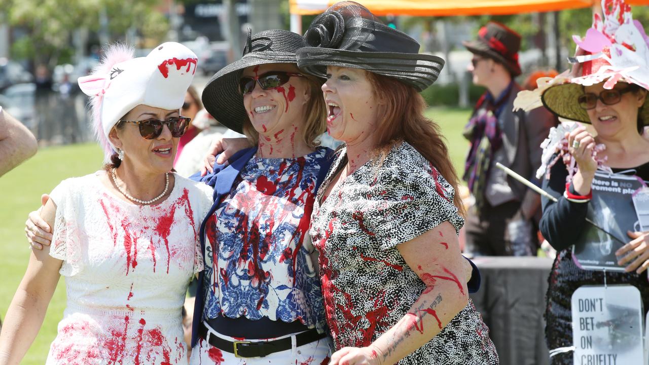 Animal activists stage a protest with mock fashion and races during Melbourne Cup Day outside Flemington Racecourse in Melbourne. Picture: David Crosling/AAP