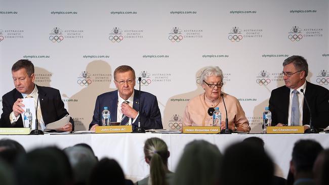 John Coates surrounded by key Australian Olympic Committee executives, CEO Matt Carroll (left) and vice-presidents Helen Brownlee (right) and Ian Chesterman (far right) at the AOC annual general meeting in May.