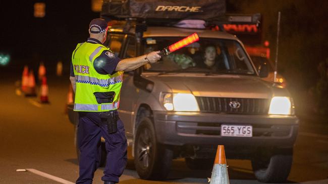 Police direct motorists at the Queensland border checkpoint at Coolangatta earlier this morning. Picture: Glenn Hunt