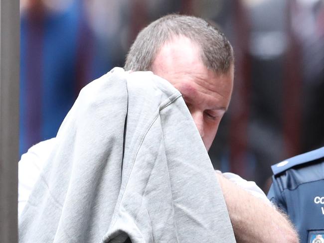 Scott Murdoch is taken into the Victorian Supreme Court in Melbourne today. Picture: David Crosling/AAP