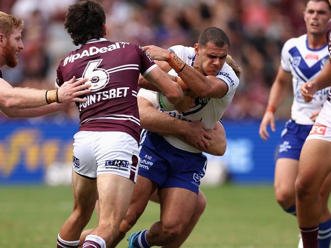 SYDNEY, AUSTRALIA - MARCH 04: Jacob Kiraz of the Bulldogs is tackled during the round one NRL match between the Manly Sea Eagles and the Canterbury Bulldogs at 4 Pines Park on March 04, 2023 in Sydney, Australia. (Photo by Cameron Spencer/Getty Images)