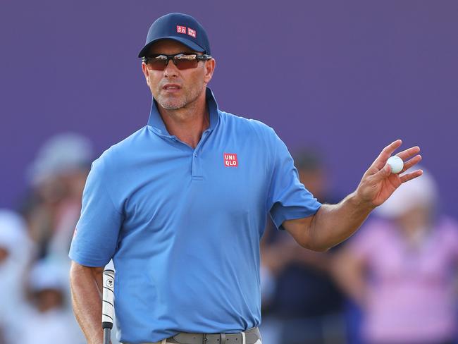 DUBAI, UNITED ARAB EMIRATES - NOVEMBER 15: Adam Scott of Australia acknowledges the crowd on the 18th green on day two of the DP World Tour Championship 2024 at Jumeirah Golf Estates on November 15, 2024 in Dubai, United Arab Emirates. (Photo by Andrew Redington/Getty Images)