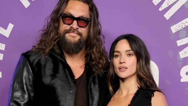 NEW YORK, NEW YORK - FEBRUARY 14: (L-R) Jason Momoa and Adria Arjona attend SNL50: The Homecoming Concert at Radio City Music Hall on February 14, 2025 in New York City.  (Photo by Dia Dipasupil/Getty Images)