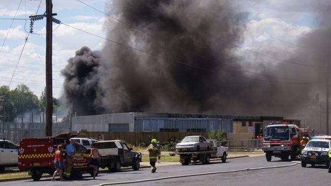 Smoke hangs over the scene of a grassfire in William St, Orange yesterday. A boy has been charged over sparking the fire. Picture: Gavin Coote ‏@GavinCoote