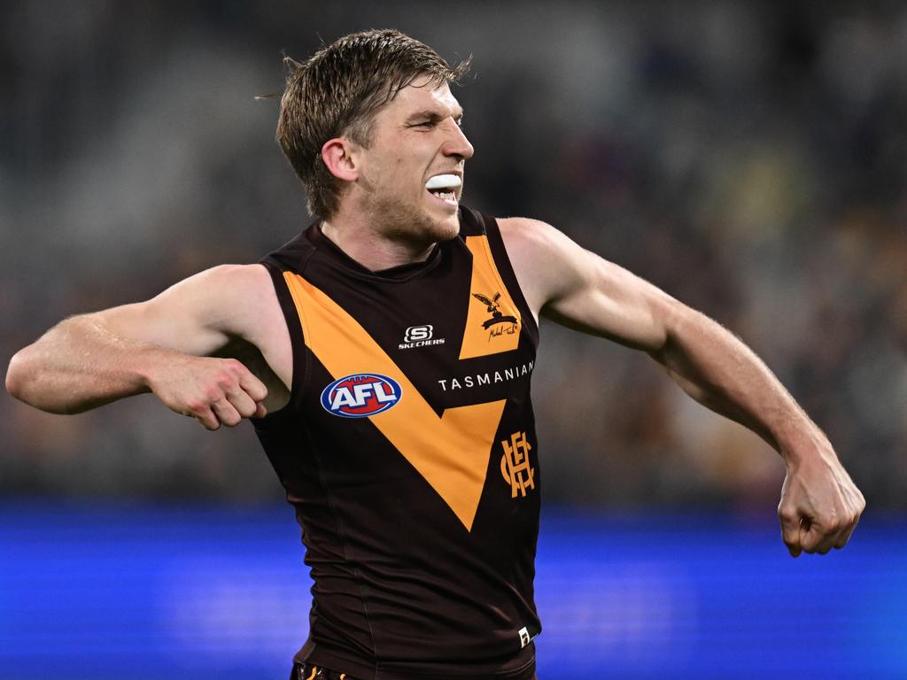 GEELONG, AUSTRALIA - JULY 06: Dylan Moore of the Hawks celebrates kicking a goal during the round 17 AFL match between Geelong Cats and Hawthorn Hawks at GMHBA Stadium, on July 06, 2024, in Geelong, Australia. (Photo by Daniel Pockett/Getty Images)