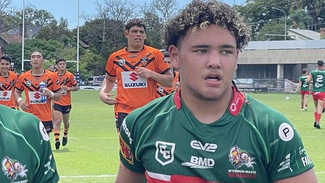 Wynnum-Manly player Majah-Jose Peachey, right, and a teammate, leave the field.