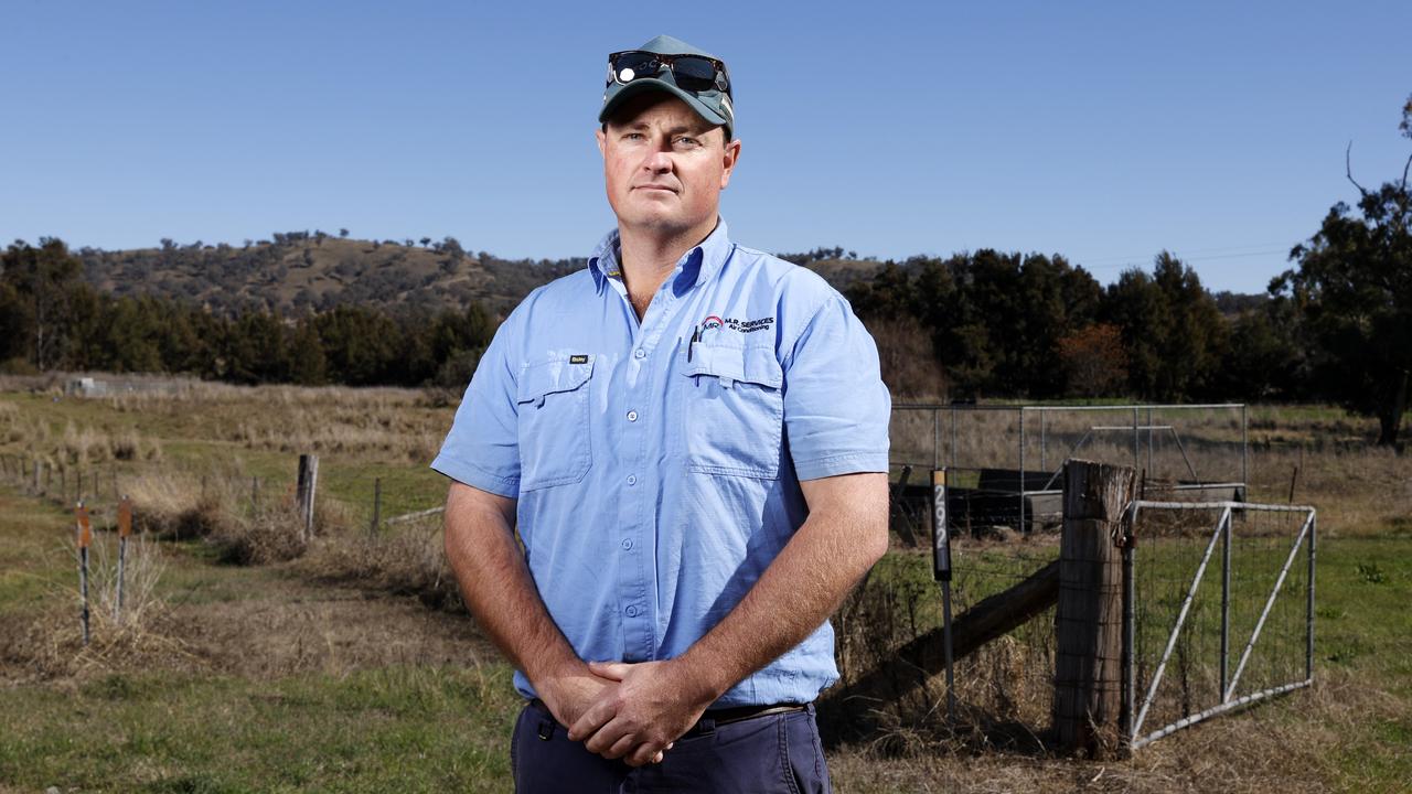 Farmer Josh Crowe says his relationship with his neighbour has fractured over their decision to install 750,000 solar panels on their land. Picture: Jonathan Ng