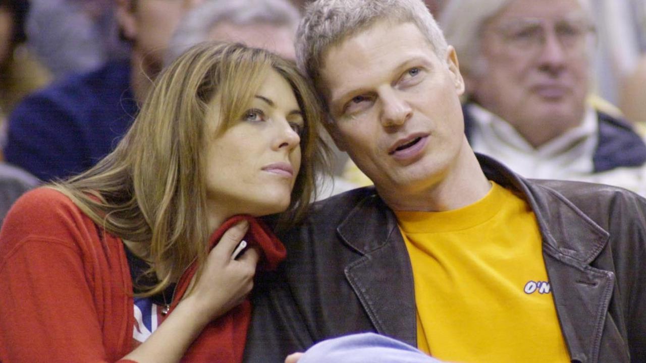 Actress Elizabeth Hurley and Steve Bing take in the Los Angeles Lakers in 2001. Picture: Mega Agency.