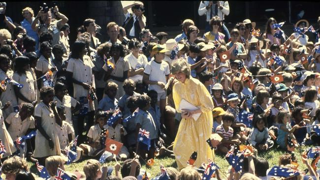 Diana, Princess of Wales is pictured amid a large group of schoolchildren during her visit to Alice Springs, Australia, March 21, 1983. (AP Photo/Dave Caulkin)