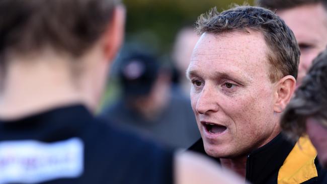 OUT THE DOOR: Goodwood coach Trent Mills addresses his players against Salisbury North. Mills has resigned on the eve of the finals after being told by the committee he would not be coaching next season. Picture: Tom Huntley.