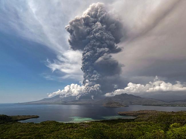 TOPSHOT - This aerial handout picture taken on November 9, 2024 and released on November 10, 2024 by the National Disaster Mitigation Agency shows the eruption of Mount Lewotobi Laki Laki as seen from the Eputobi rest area in East Flores, East Nusa Tenggara. (Photo by Handout / National Disaster Mitigation Agency / AFP) / RESTRICTED TO EDITORIAL USE - MANDATORY CREDIT AFP PHOTO / National Disaster Mitigation Agency - NO MARKETING - NO ADVERTISING CAMPAIGNS - DISTRIBUTED AS A SERVICE TO CLIENTS