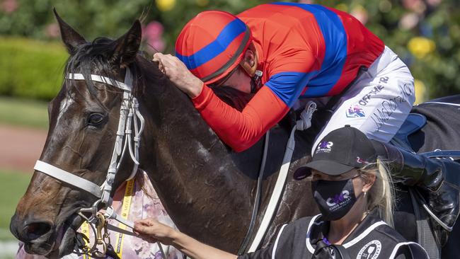 Verry Elleegant is hugged by James McDonald after winning the 2021 Melbourne Cup.