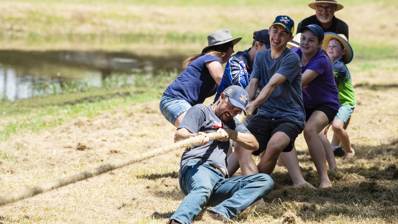 Brendan Jones (front) strains to hold his team together during the tug-o-war competition at Oakey Australia Day celebrations in Arthur Shooter Park, Thursday, January 26, 2023. Picture: Kevin Farmer