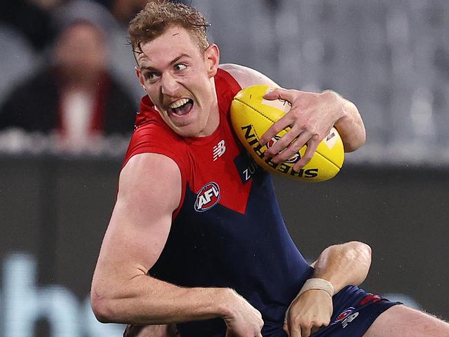 AFL Round 8.   08/05/2021. Melbourne vs Sydney Swans at the MCG, Melbourne.   Harrison Petty of the Demons tackled by Sydneys Tom Papley during the 3rd qtr.   . Pic: Michael Klein