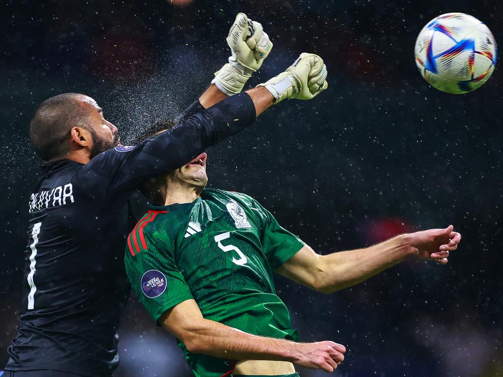 Edrick Menjivar of Honduras battles for the ball against Johan Vasquez of Mexico during the CONCACAF Nations League quarterfinals. Picture: Hector Vivas/Getty Images