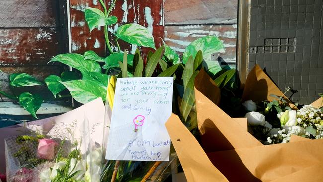 Flowers left as a memorial at the site. Picture: Jeremy Piper