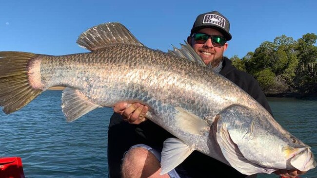 Brendan Pollard with an enormous barramundi caught in Mackay.