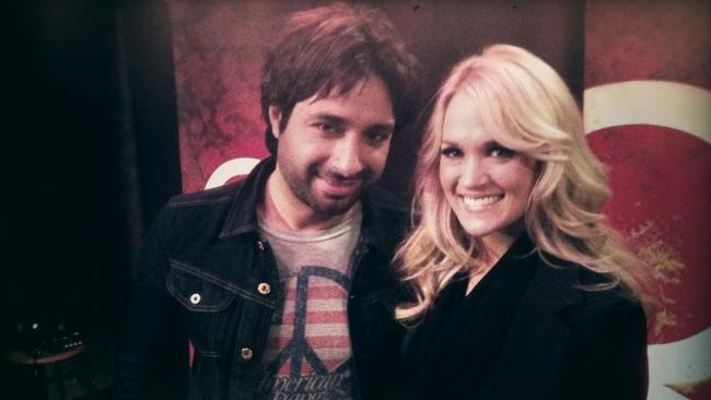 National treasure ... Jian Ghomeshi with country music star Carrie Underwood.