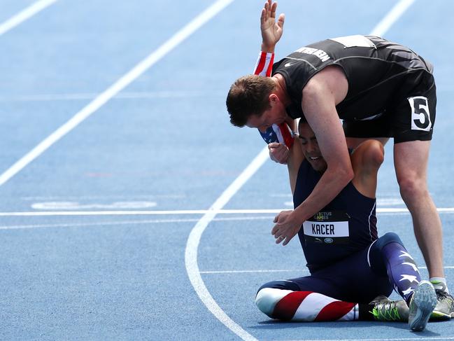 Craig Wilson of New Zealand embraces Mike Kacer of the United States following the Men's 1500m IT3. Picture: Cameron Spencer/Getty Images