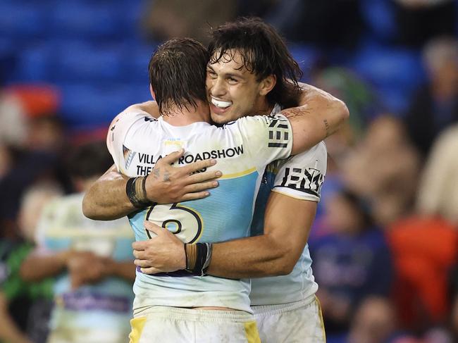 Tino Fa'asuamaleaui and AJ Brimson of the Titans celebrate their win over Newcastle Knights. Picture: Getty Images
