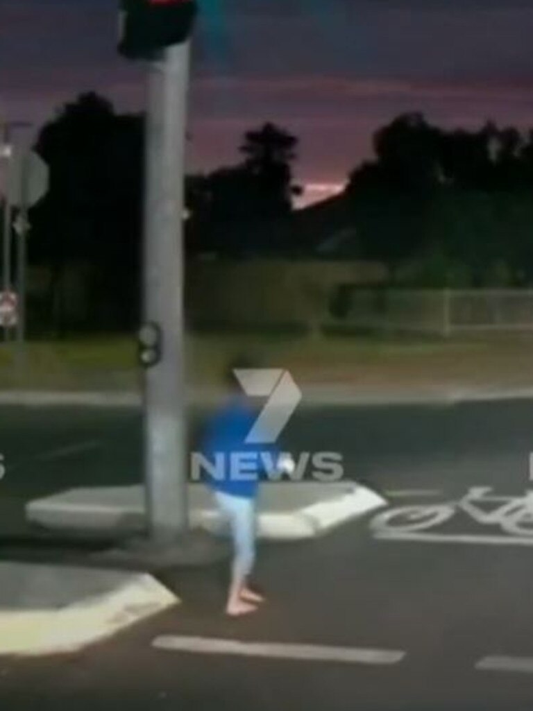 Dashcam footage shows a child dangerously close to moving cars.