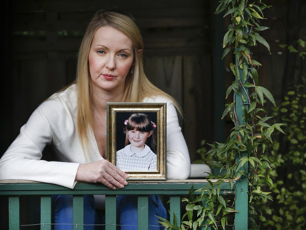 Jaime holding a picture of herself as a child. Picture: David Caird