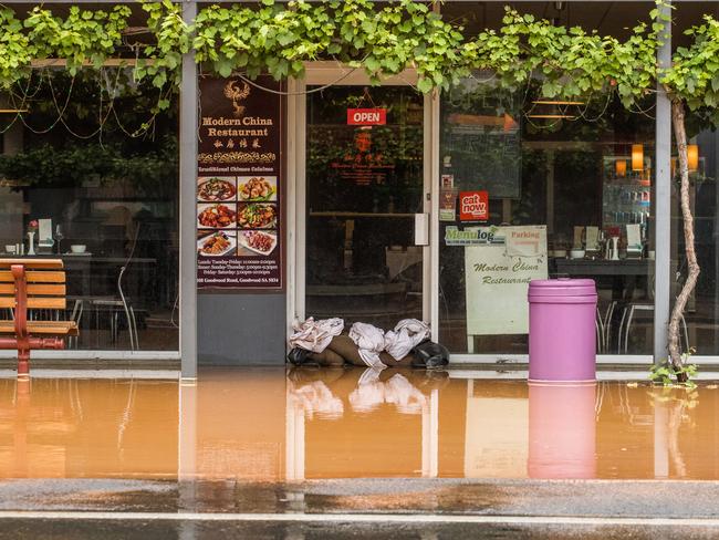 Shops were forced to sandbag their premises. Picture: MATT LOXTON