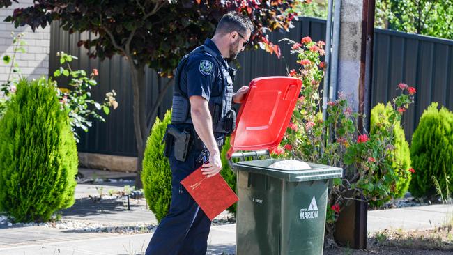 An officer searches for evidence along Dunorlan Road in Edwardstown, where the man was found. Picture: NCA NewsWire / Brenton Edwards