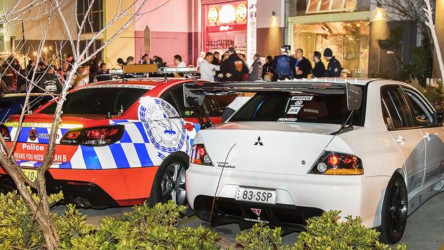 A Highway Patrol car sits alongside Senior Constable Steven Planinic's Mitsubishi Evolution 9. Photo Credit: Bronwyn Holmes, Chequered Photography