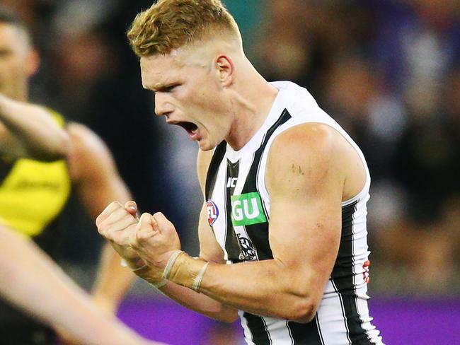 MELBOURNE, VICTORIA - SEPTEMBER 21:  Adam Treloar of the Magpies celebrates a goal during the AFL Preliminary Final match between the Richmond Tigers and the Collingwood Magpies on September 21, 2018 in Melbourne, Australia.  (Photo by Michael Dodge/AFL Media/Getty Images)