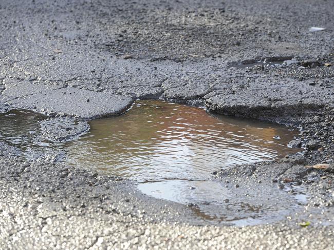 Pot holes on the corner of Marmaduke and George streets, Burwood. Picture: Craig Wilson