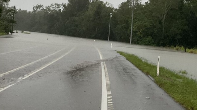 Water over the road due to flooding on the Bruce Hwy between Tully and Cardwell. Picture: QPS