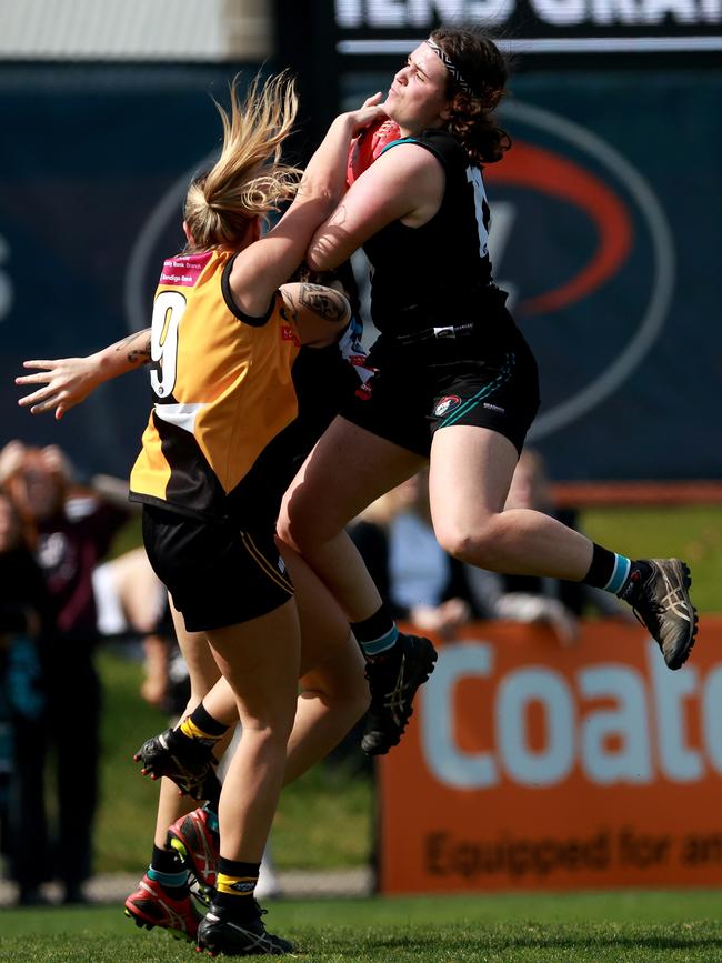 Megan Girolami takes a contested mark. Picture: Hamish Blair