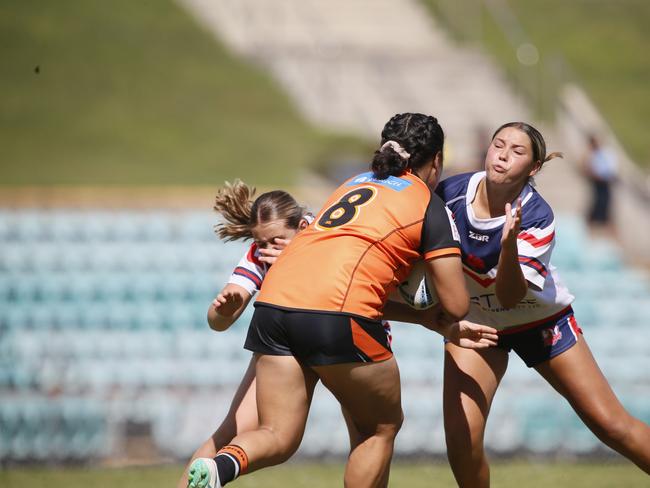 May Fuimaono takes on the line. Picture: Warren Gannon Photography