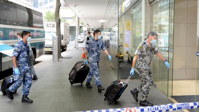 Recently returned travellers arrive at the Sofitel hotel in Sydney for their mandatory quarantine period in January. Picture: Jeremy Piper