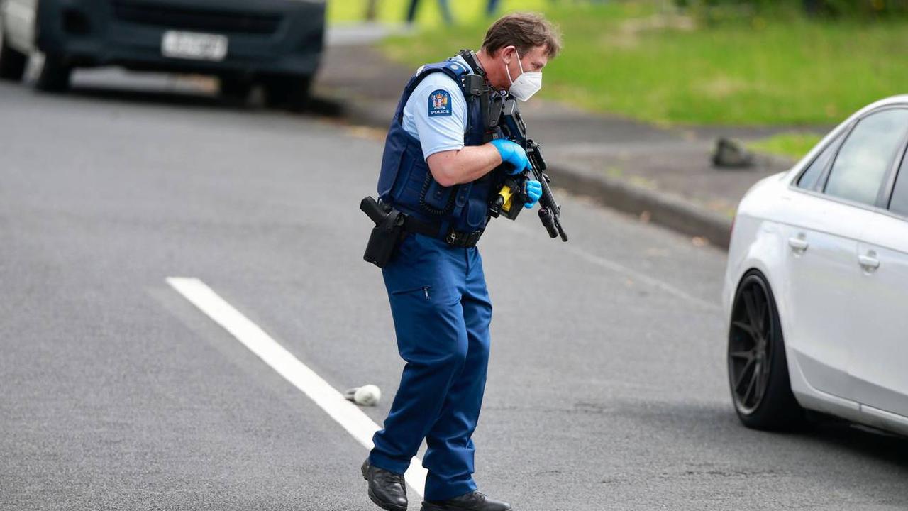 A policeman told a woman trying to enter the street that the “whole area was locked down”. Picture: Alex Burton