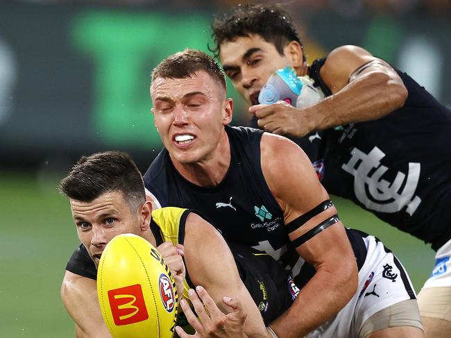 MELBOURNE . 16/03/2023.  AFL Round 1.  Richmond vs Carlton at the MCG.  Richmonds Trent Cotchin  tackled by Patrick Cripps of the Blues during the 1st qtr.   . Pic: Michael Klein