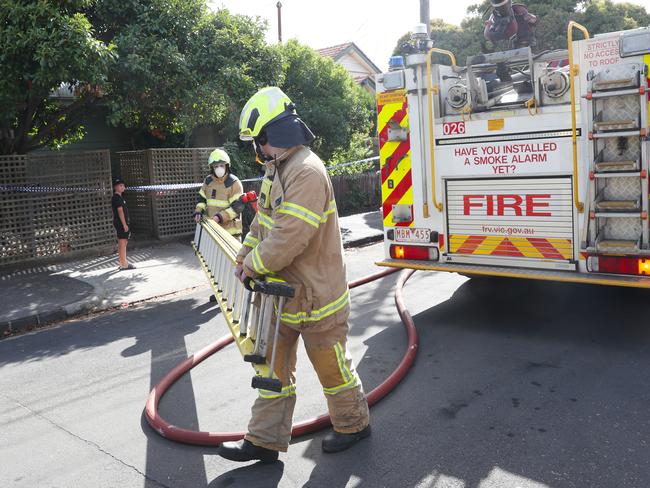 Two people are in a critical condition and another has serious injuries after a fire ripped through a home in Brunswick. Picture: David Crosling