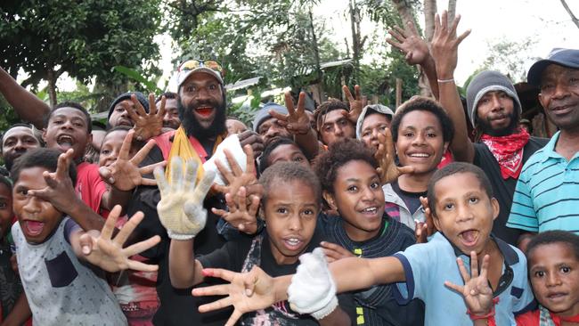 PNG league fanatics in Kundiawa, the birthplace of Melbourne Storm rising star Justin Olam, can't get enough of the local legend. Picture: PNG Post-Courier