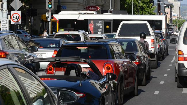 Huge delays during peak hour as traffic heading east along Franklin St is blocked by buses travelling north along King William St. Picture: Brenton Edwards