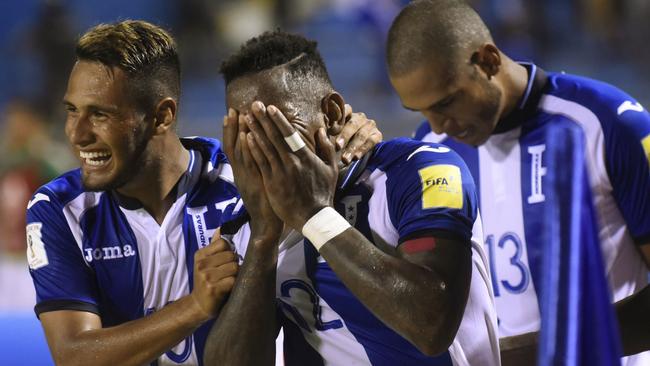 Honduras' Romell Quioto (centre) celebrates with teammates after scoring against Mexico. Picture: AFP