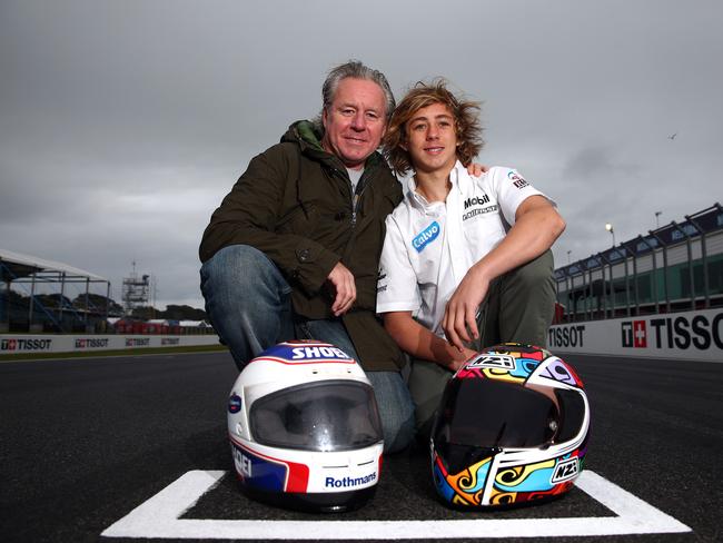 Former 500cc world champion Wayne Gardner poses with son Remy on Phillip Island.