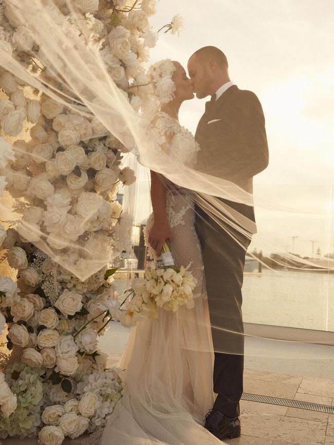 Gonsalves wore a long-sleeved gown with an illusion neckline and a dramatic train for her private ceremony. Photo: Instagram