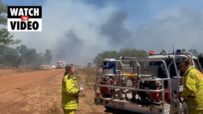 Fireys battle a bushfire in Humpty Doo