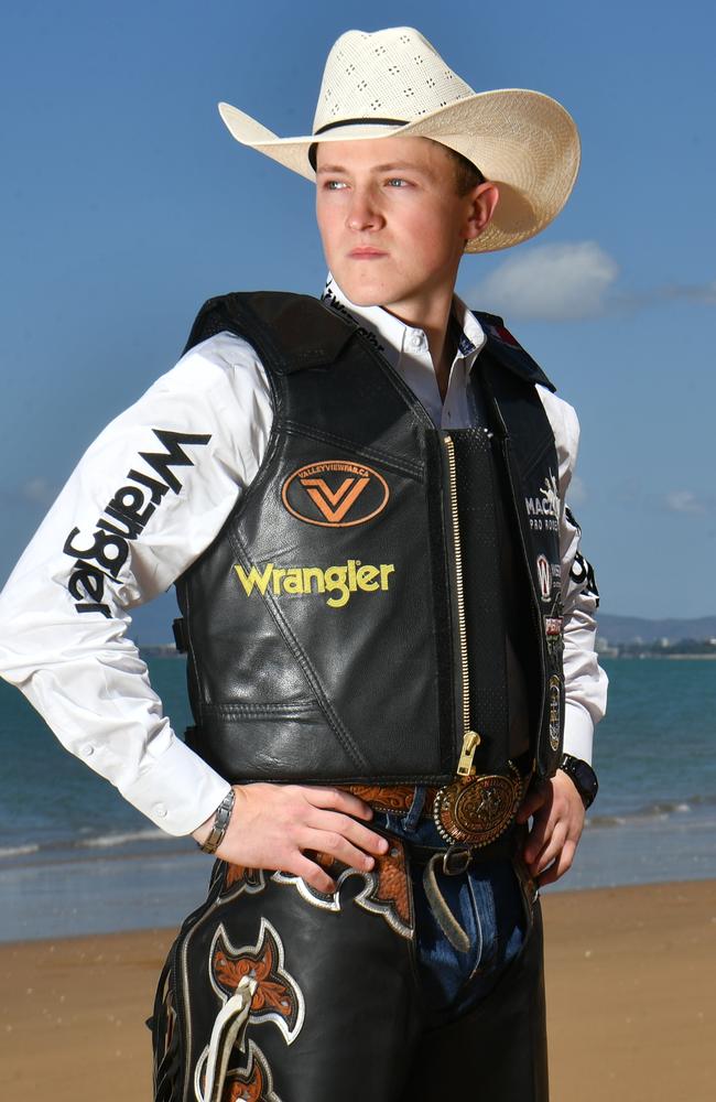 PBR Canadian Cowboys Chanse Switzer braves the Townsville heat in his chaps and vest, as he overlooks Magnetic Island. Picture: Evan Morgan