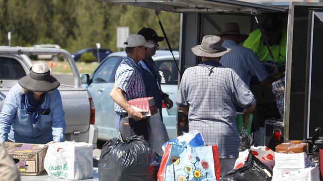 There was lots of help on hand when the flights came into Ballina Byron Gateway Airport on Tuesday. Picture: Liana Boss